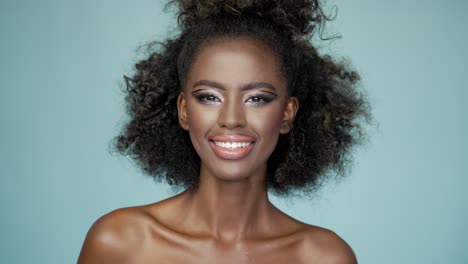 beautiful woman with stylish afro and makeup