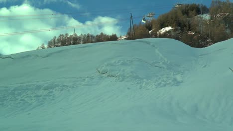 Slow-motion-footage-through-the-car-side-window-while-driving-in-the-Swiss-Alps