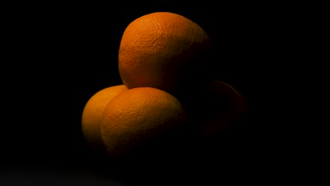 Static-shot-of-orange-fruit,-black-background,-text-place-holder