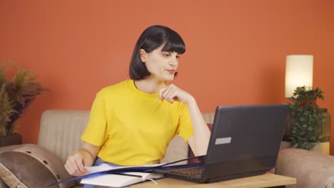 The-woman-looking-at-the-documents-is-thoughtful.