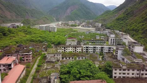 Aerial-shot-viewing-damaged-residential-buildings-after-the-earthquake-hit-in-Sichuan-province-of-Lidung-County,-China