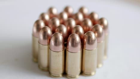 Close-up-of-many-ammunition-are-arranged-in-a-row-and-rotated-with-a-rotating-platform