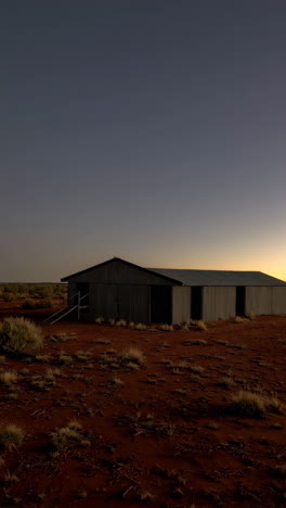 rustic corrugated iron shed in the australian outback at twilight