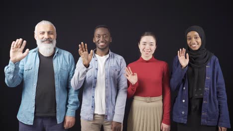 multiethnic group of adult friends waving together. fraternity and interracial friendships.