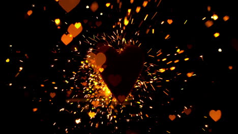 confeti dorado y chispas volando contra el corazón