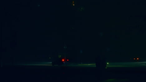 people walking in foggy night
