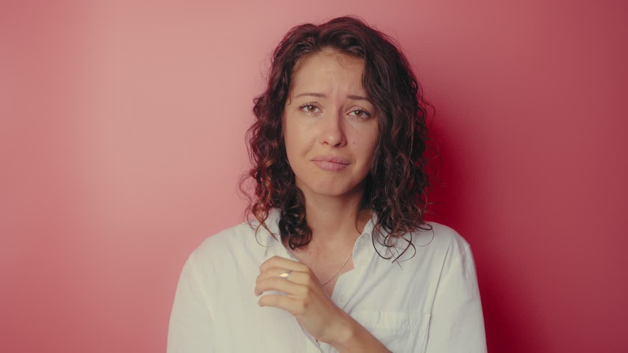 Woman appearing sad and unhappy