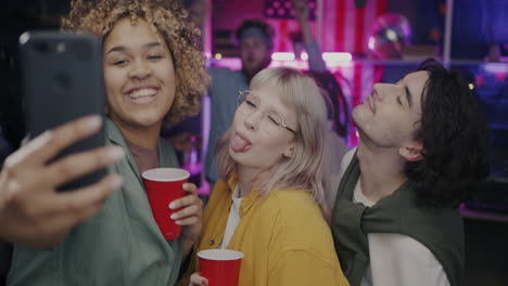 friends taking a selfie at a party