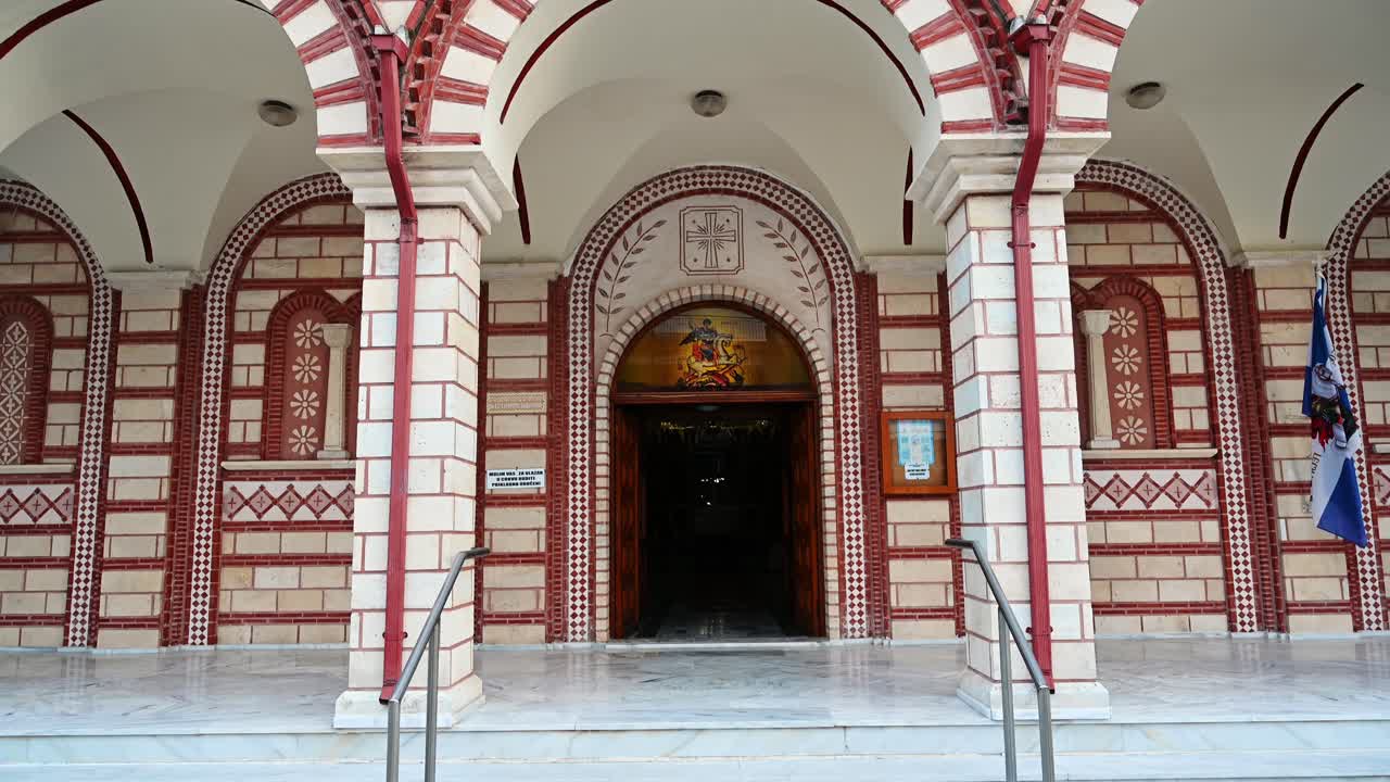 Church of Saint George entrance with floor is made of marble, columns in front of it in Asprovalta, Greece