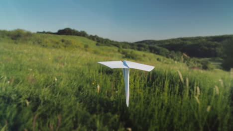 A-Real-Paper-Airplane-Is-Flying-Over-A-Picturesque-Valley-Pov-Video