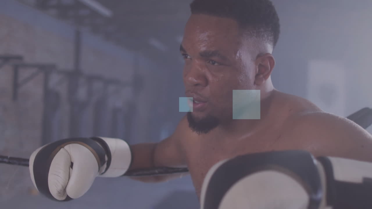 Resting on ropes in gym, boxer with determined expression after training animation