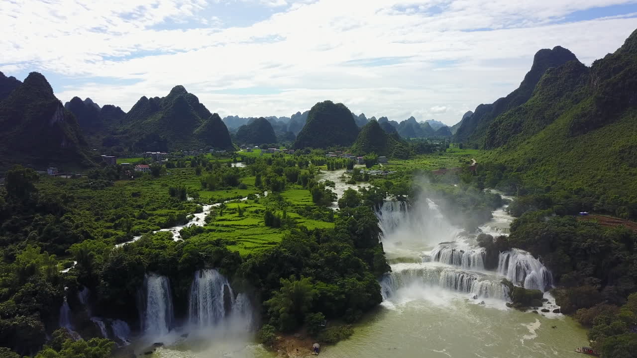 Ban Gioc Waterfalls cascade in stunning lush green mountain scenery