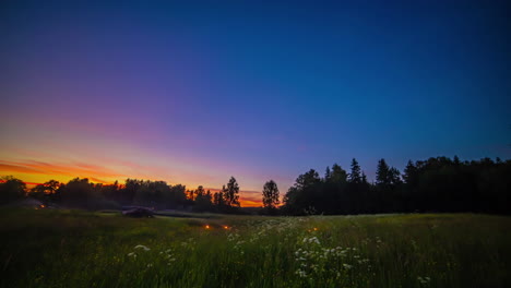 stunning sunset then bonfires as people enjoy a night in the countryside - all night and day time lapse