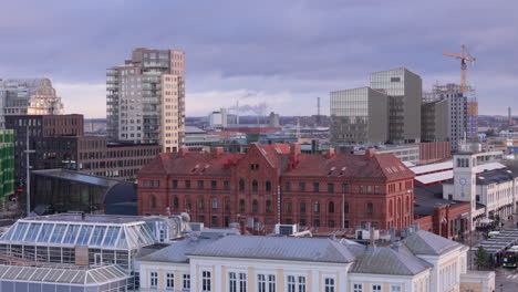 Malmo-skyline-view-with-prominent-west-facade-of-Central-Station,-aerial-view