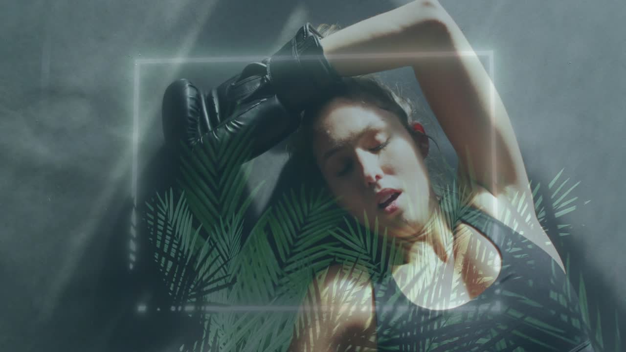 Boxer lying on mat gasping wiping sweat with black glove while neon-square palmleaf overlay pulsing