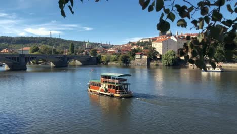 river boat cruises along vltava in prague on spring day