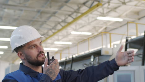 plant supervisor giving instructions on walkie-talkie