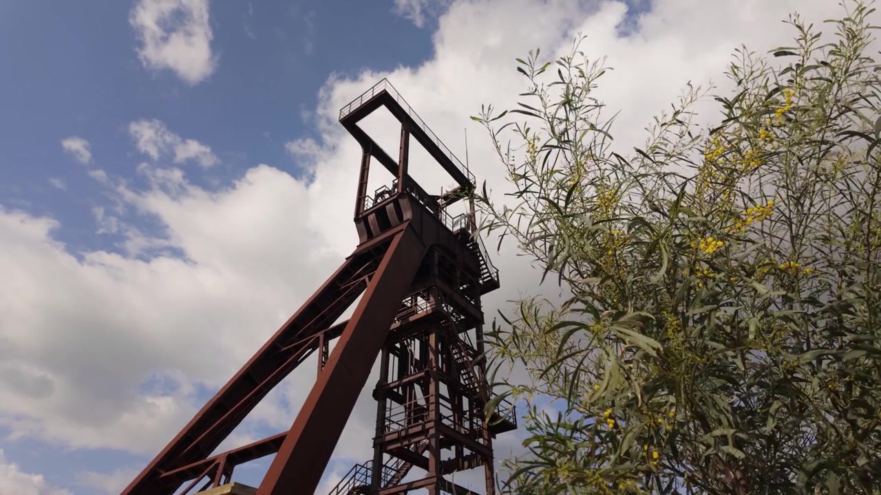The Headframes Of The Serbariu Mine (Grande Miniera di Serbariu) At The Historic Coal Mining Complex In Carbonia, Sardinia, Italy. Low-angle Shot