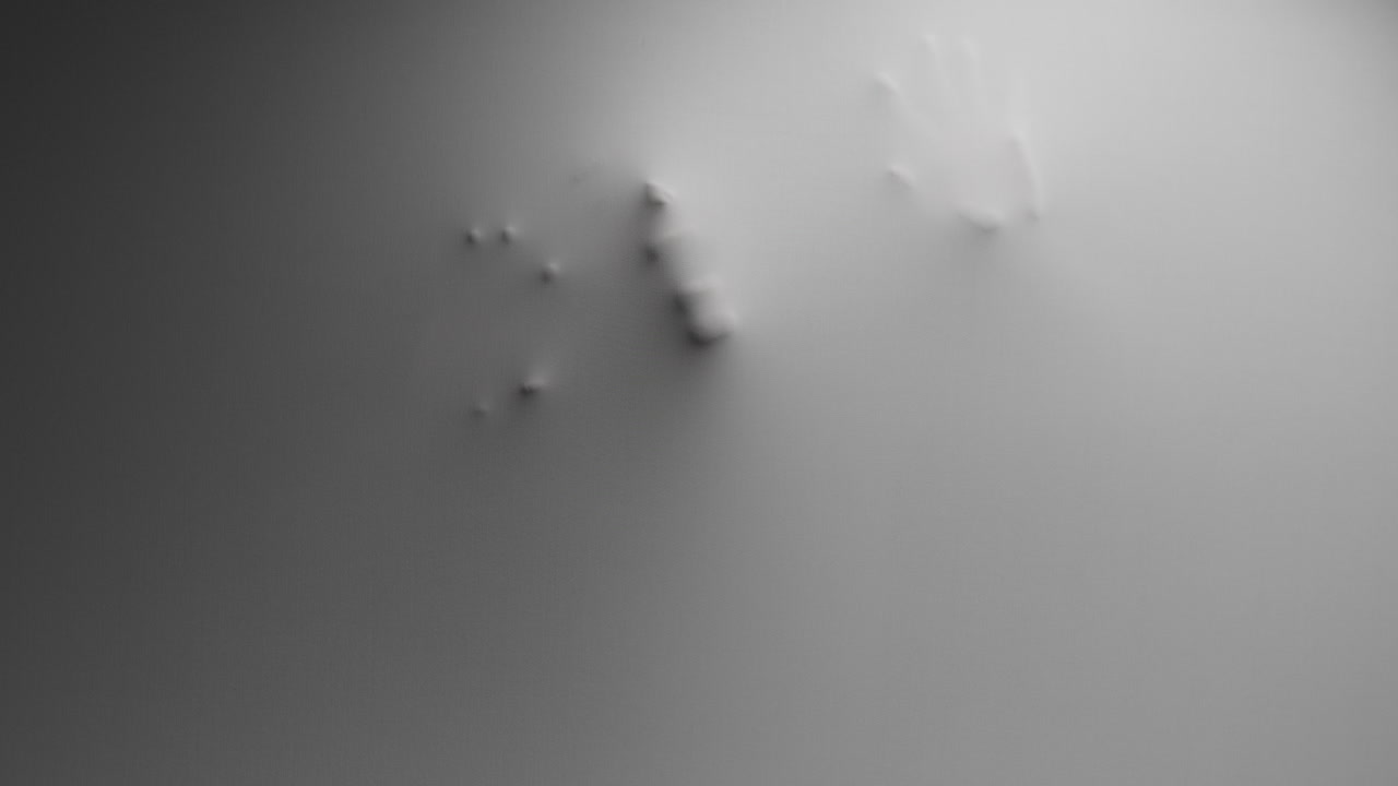A scary silhouette of a woman appears from the white surface