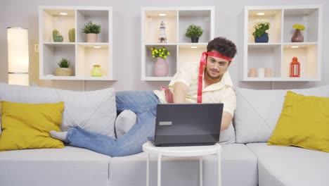 Man-working-on-laptop-with-funny-expression.