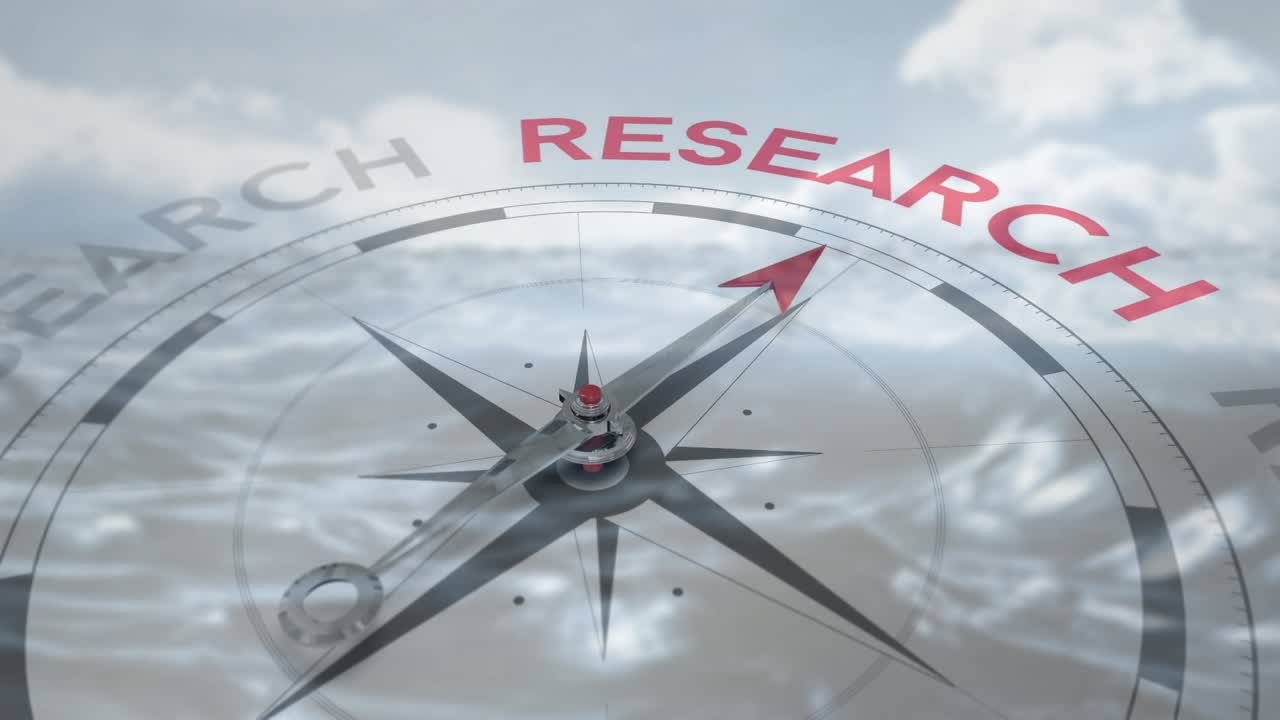 Metallic compass needle rotating as camera pulling back, revealing RESEARCH while clouds rippling