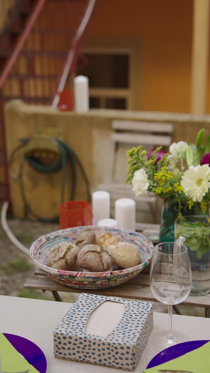 Outdoor Patio Meal with Flowers and Bread