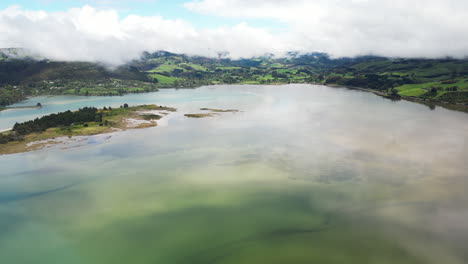 Majestic-mountains-and-water-reflection-in-Warrington-Domain,-New-Zealand