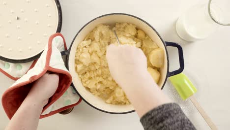 preparing classic mashed potatoes for thanksgiving dinner.