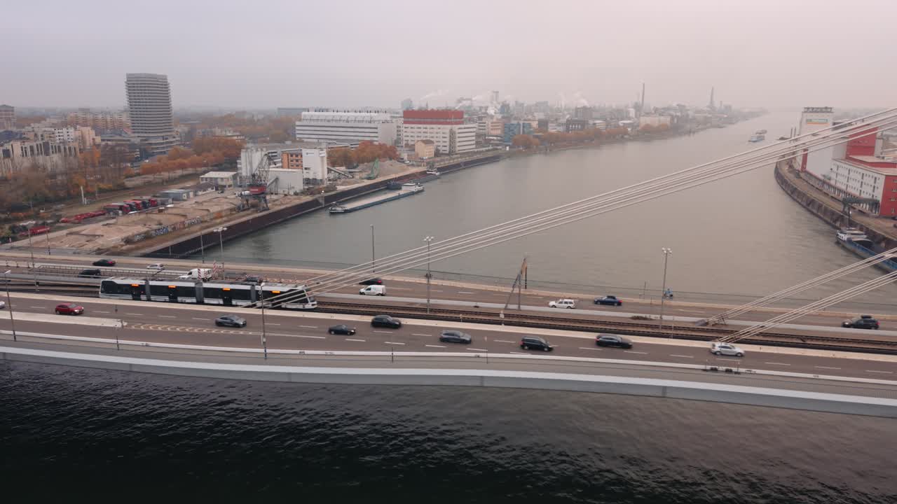 Symmetrical Aerial Zoom Out over Friedrich Ebert Bridge and Rhine River in Mannheim