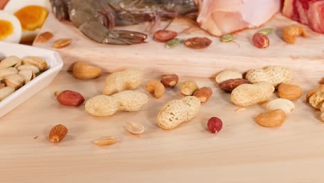 Variety of meats, nuts, and cheeses displayed together