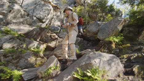 senior hiking in rocky mountains