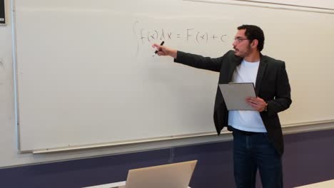 young lecturer demonstrates calculus integration