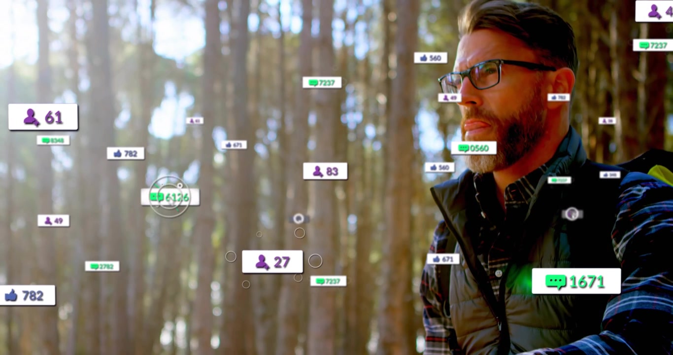 Mature hiker holding paper map in forest as AR social badges appearing, looking and assessing route