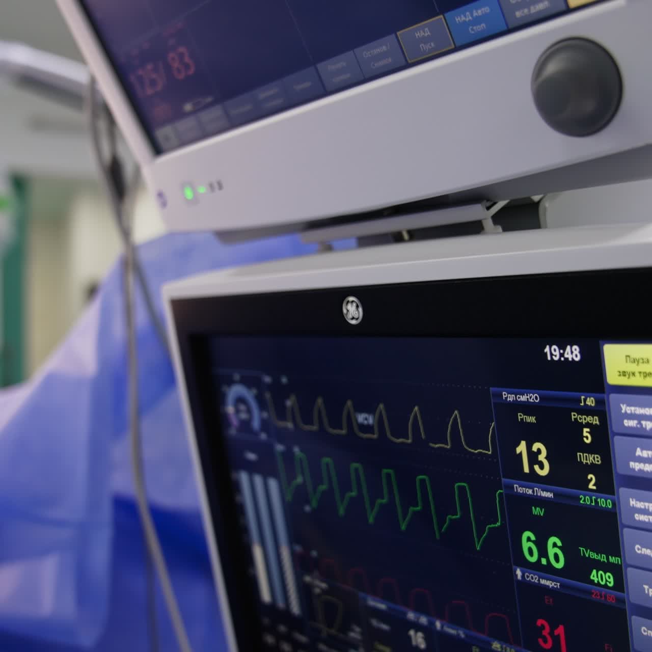 Switched on screens working in the surgery room at operation. Monitors showing the life signs of patient under anesthesia. Close up