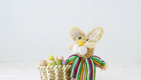 basket with easter eggs and easter bunny