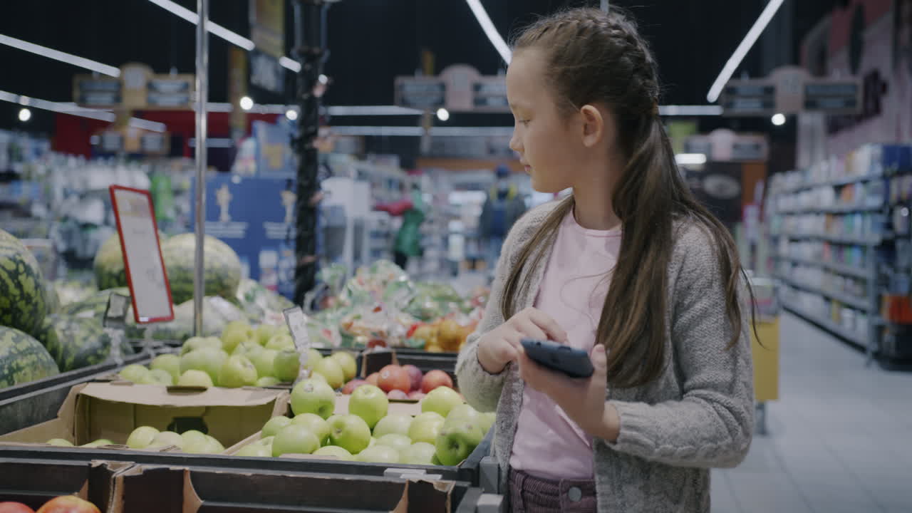 Girl Shopping for Fruits in a Grocery Store