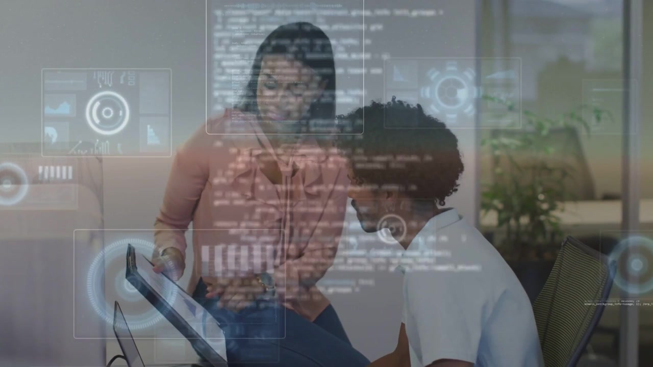 Woman showing tablet, rotating to monitor as man leaning in, HUD expanding for business