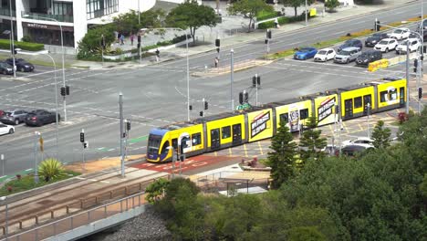 glink translink urban public transportation, tram running on tramway along gold coast highway towards broadbeach south station, queensland, australia