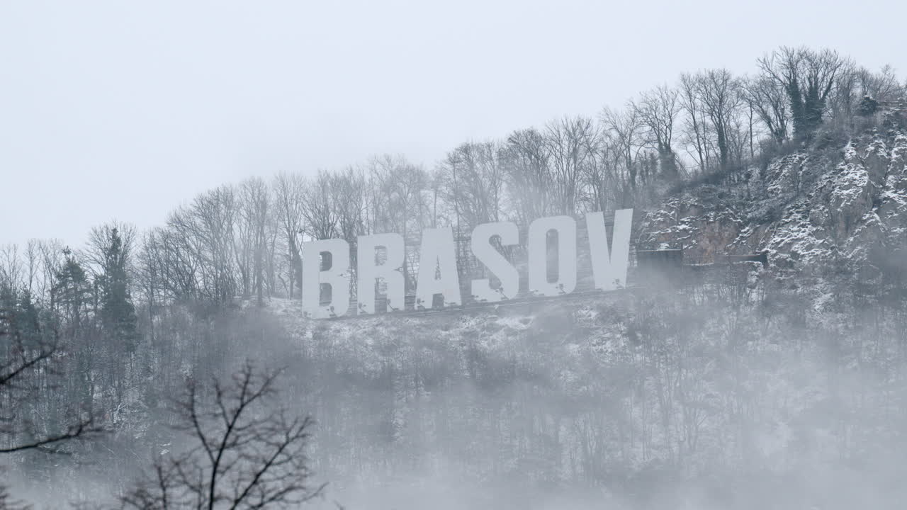 Brasov writing on the top of the Tampa mountain in the snow