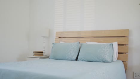 view of bedroom with bed and night table with books