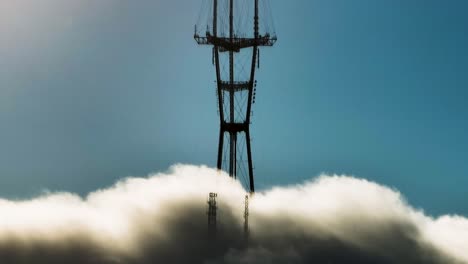 Twin-Peaks-tower,-lol-layer-of-fog-over-San-Francisco