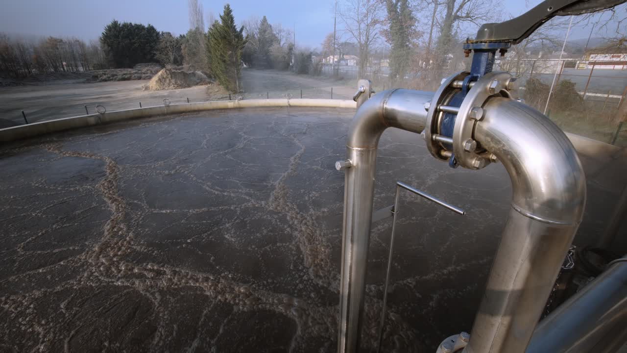 Aeration tank with bubbling water, symbol of purification and renewal.