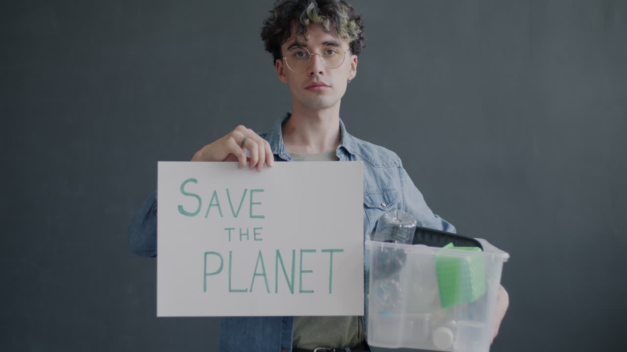 Young Man Holding Sign for Environmental Conservation