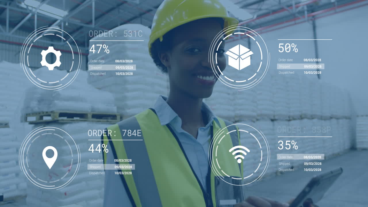 Using digital interface, warehouse worker in safety gear tracking order data