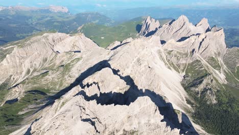 Aerial-view-of-the-Dolomites-showcasing-the-striking-peaks-of-Sass-Rigais-and-Seceda