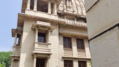 low-angle shot of dome and ornate balconies at kirti mandir, vadodara—symbol of maratha legacy and indian heritage.