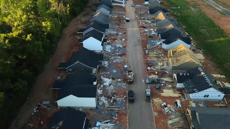 aerial flyover of a construction site with unfinished houses