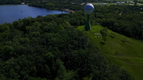Establishing-Drone-Shot-of-the-Small-Rural-Town-Killarney-Water-Tower-in-Turtle-Mountain-Park-Manitoba-Canada