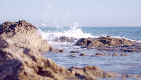 ocean waves in slow motion on a rocky coastline