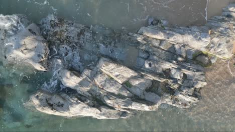 rising drone footage of large stones in the sea at arenys de mar catalunya